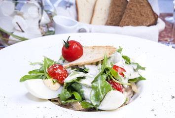 salad with eggs and vegetables with sauce in a restaurant