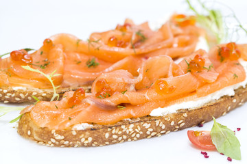sandwiches with salmon caviar and greens adorned