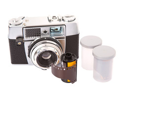 Old retro analog camera with new film roll over white background