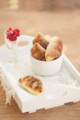 Mini cheese breads on wooden table