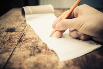 Writing on a roll of toilet paper