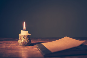 Notebook and candle