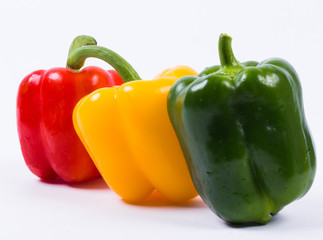Colour peppers on white background
