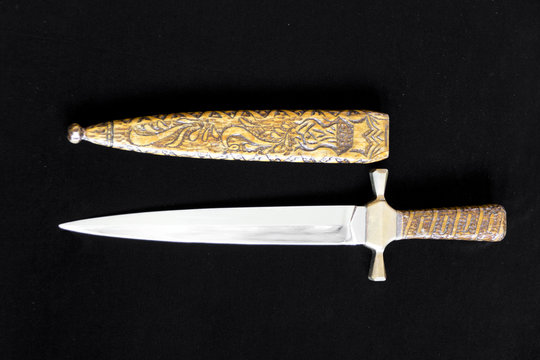 Cold weapon on black background