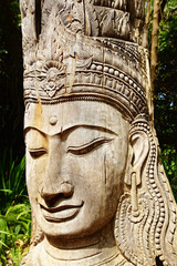 Fototapeta na wymiar Wooden statue of Buddha.