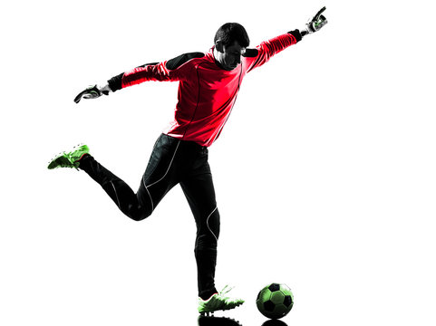caucasian soccer player goalkeeper man kicking ball silhouette