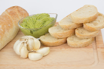 Ciabata bread slices and avocado cream with garlic