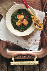 Plate of spinach and cheese curry Saag Paneer - Stock Image