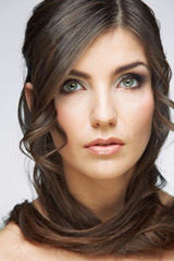 Beauty woman face portrait. Isolated on gray background