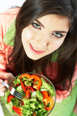 Young woman eat salad. Healthy vegetarian food.