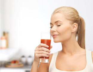 young woman drinking tomato juice