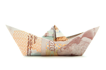 Pound money paper boat