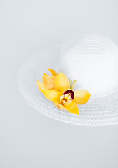 closeup of white hat and flowers