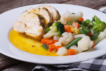 Oven baked chicken fillet with a mix of vegetables