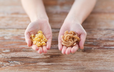 female hands with different pasta variations