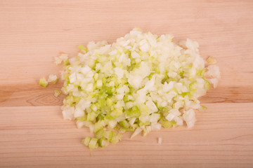 Chopped Onions and Garlic on Wood Cutting Board