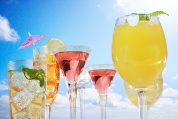 Assortment of drinks over blue sky