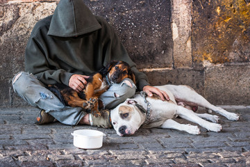 beggar with two dogs near Charles bridge, Prague