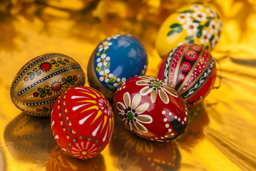 Easter eggs on gold background horizontal