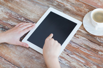 female pointing finger to tablet pc screen