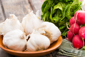 Fresh healthy garlic,. radish and lettuce