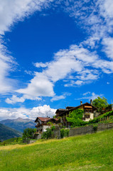 Fototapeta na wymiar Houses in Aosta Valley. Alps, Italy