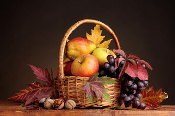 beautiful autumn harvest in basket and leaves