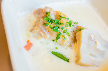 Fish with white sauce and mushroom
