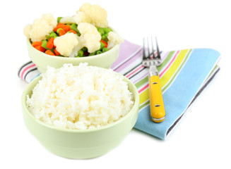 Cooked rice and vegetables isolated on white