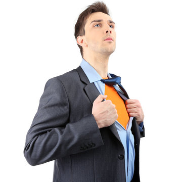 Young business man tearing apart his shirt revealing  superhero