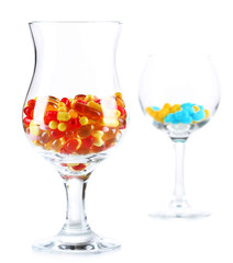 Goblets with pills isolated on white