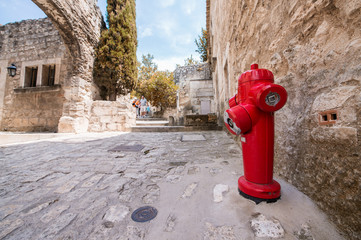 Red Hydrant on a medieval city street