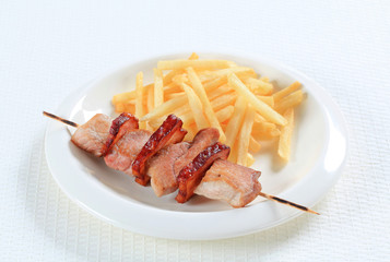 Pork skewer with French fries