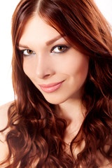 Fototapeta premium Portrait of young woman with red hair