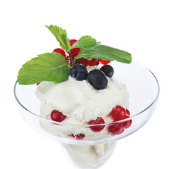 Ice cream in glass bowl with fruits isolated on white background