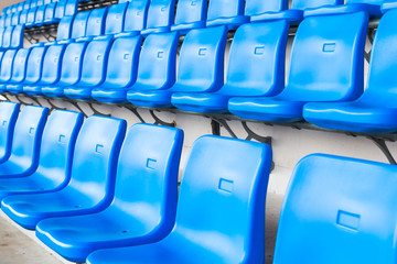 Fototapeta premium Empty dark blue chairs at the football Stadium