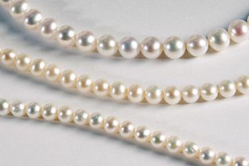 Three different strands of cultured pearls