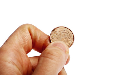 Hand holding five euro cent coin