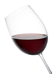 Tilted elegant glass of red wine