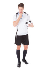 Soccer Referee Holding Football