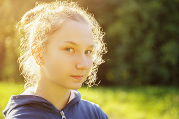 teenage girl restrained smile in front of camera