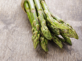 bunch of green asparagus tied with twine
