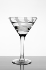 Glass goblet with water.
