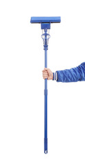 Hand holds blue mop with sponge.