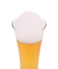 Glass of beer with foam.