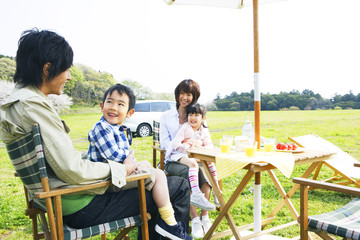 family enjoying picnic in prairie