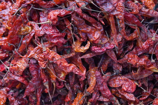 Drying red hot chili peppers at Chichicastenango market Guatemal