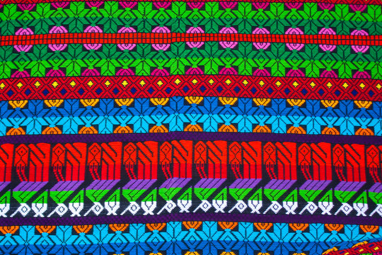Mayan ornament on a blanket at Chichicastenango market Guatemala