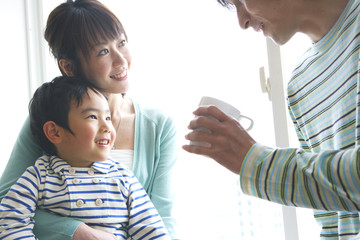 family relaxing by window