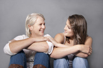 Mother and Adult Daughter laughting and joking